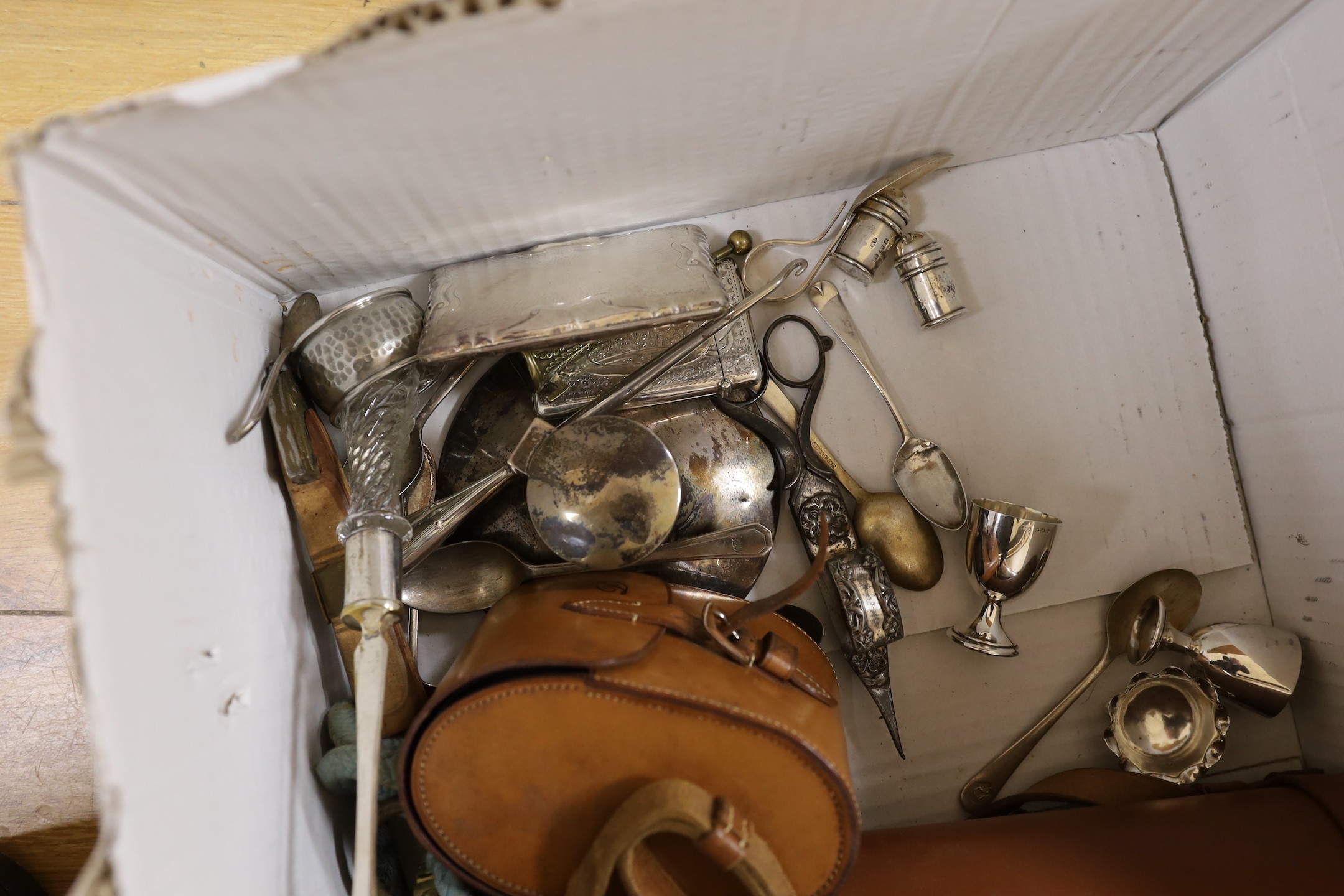 A George V silver capstan inkwell and a cased silver hair brush, two leather cased plate mounted glass flasks and tumbler sets, a George V cased silver christening bowl and mug set, a leather cased pair of silver hair br